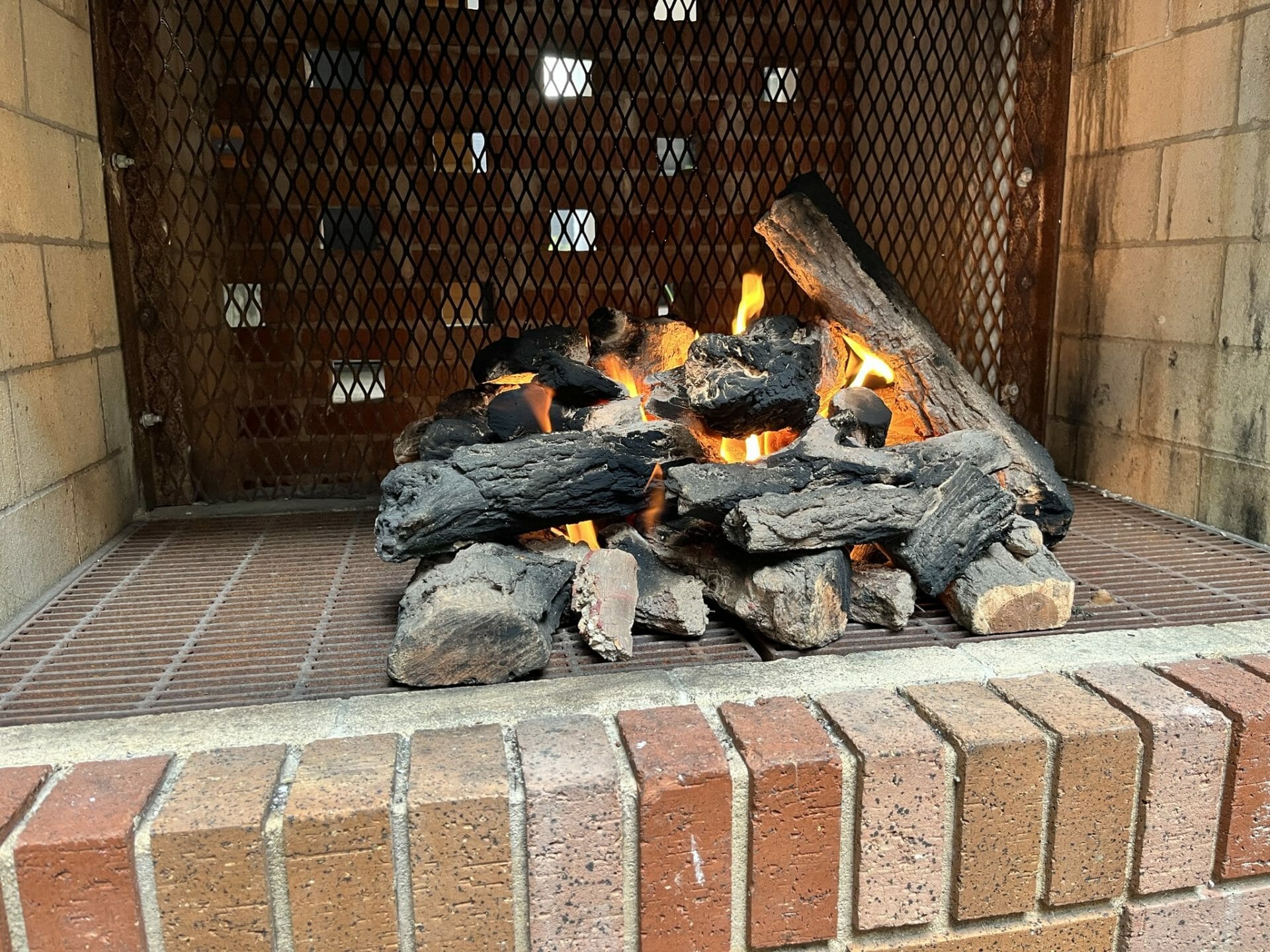 gas fire in brick fireplace