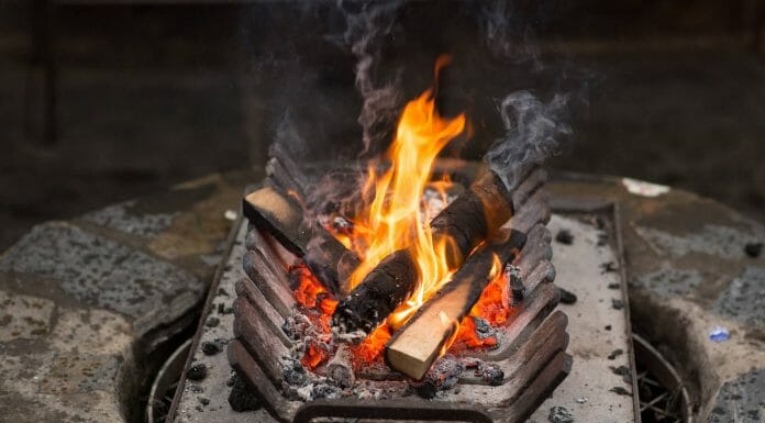 The 7+ Best Fireplace Grates for 2023: Types + FAQs fire burning in fireplace grate