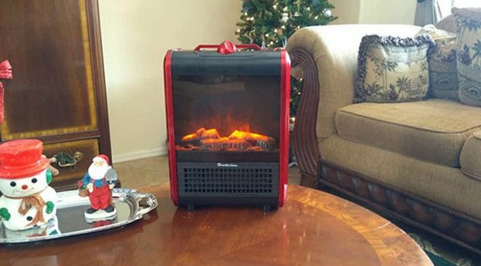 Small Portable Electric Fireplaces: Everything You Need To Know A small fireplace sitting on a table in a living room.