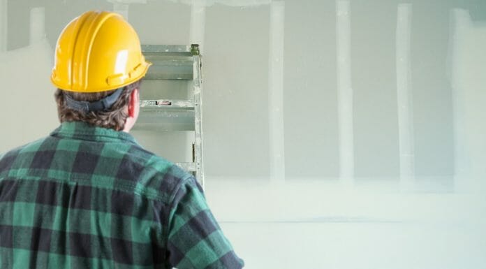How to Attach a Mantel to Drywall: A Step-by-Step Guide man working with drywall