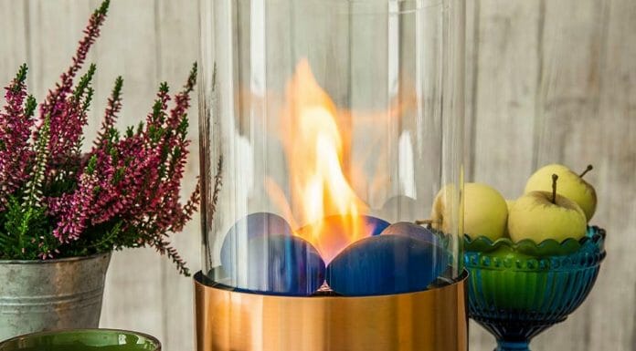 Does a Gas Fireplace Need a Chimney A glass fire holder with a candle in it.